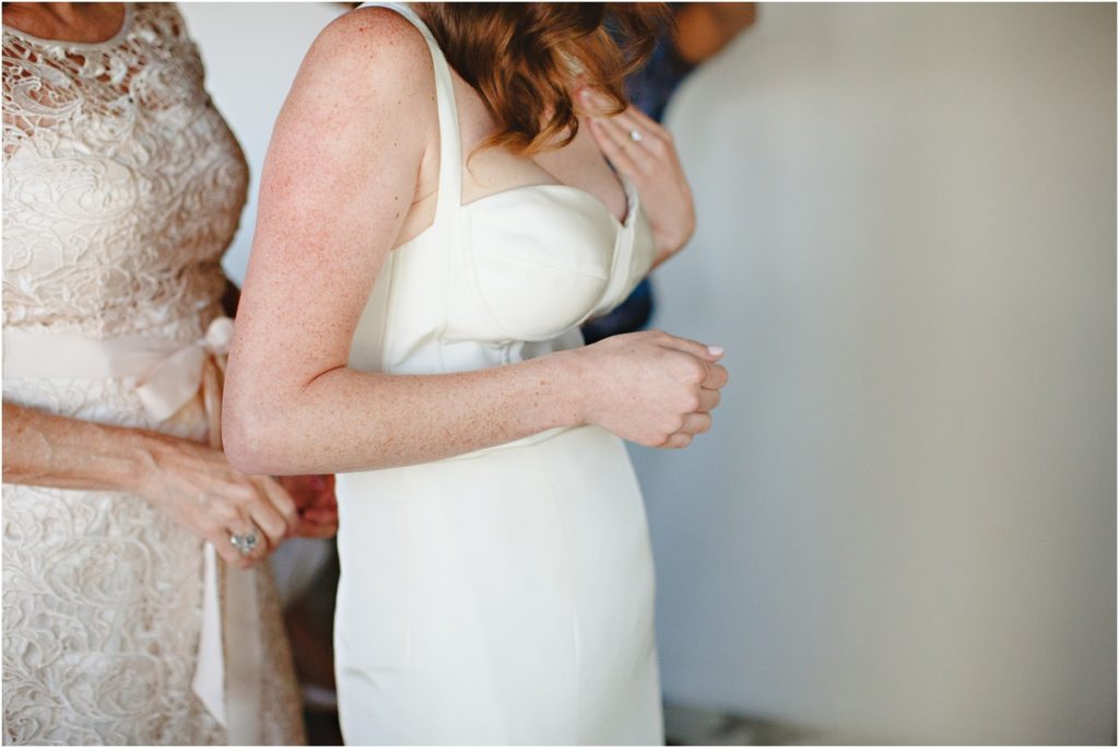 Bride Getting Dressed at Mama Shelter | Stacee Lianna Photography